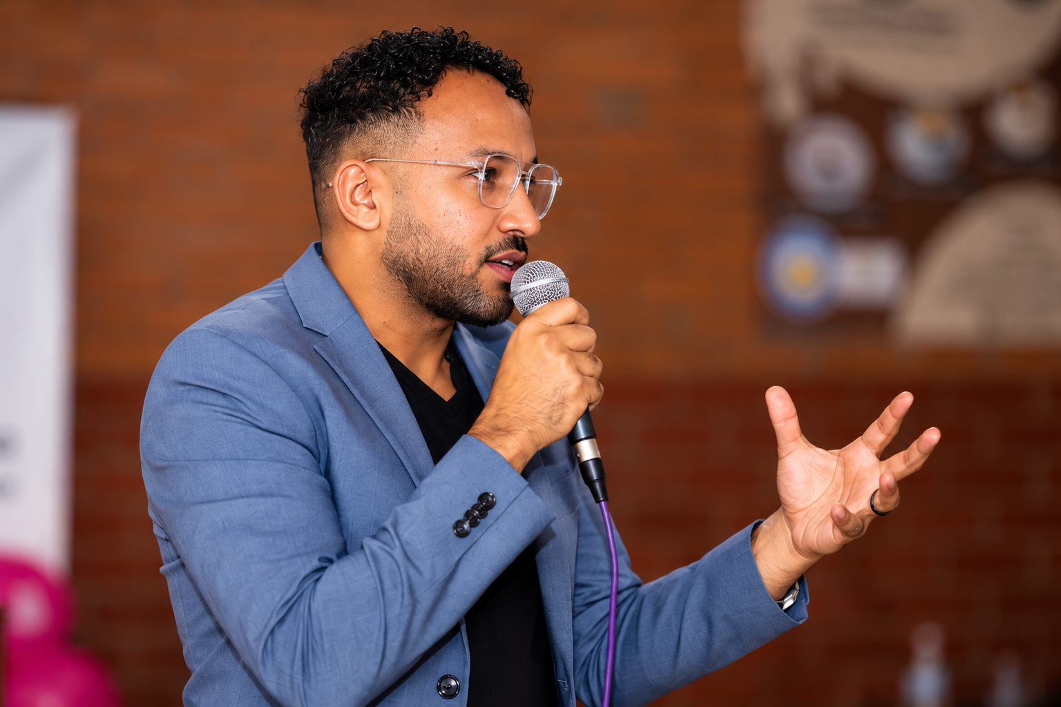 Dr. Mohanad Ali speaking into a microphone